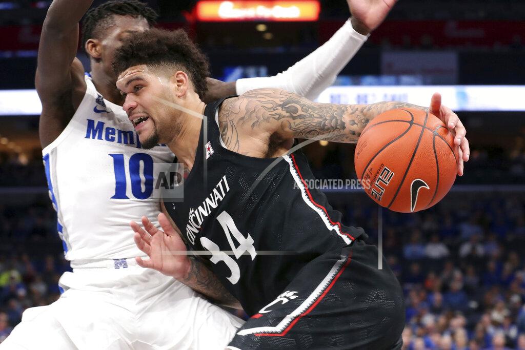 Karen Pulfer Focht Memphis' guard Damion Baugh (10) defends Cincinnati's guard Jarron Cumberland (34) in the first half of an NCAA college basketball game Thursday, Jan. 16, 2020, in Memphis, Tenn. (AP Photo/Karen Pulfer Focht)