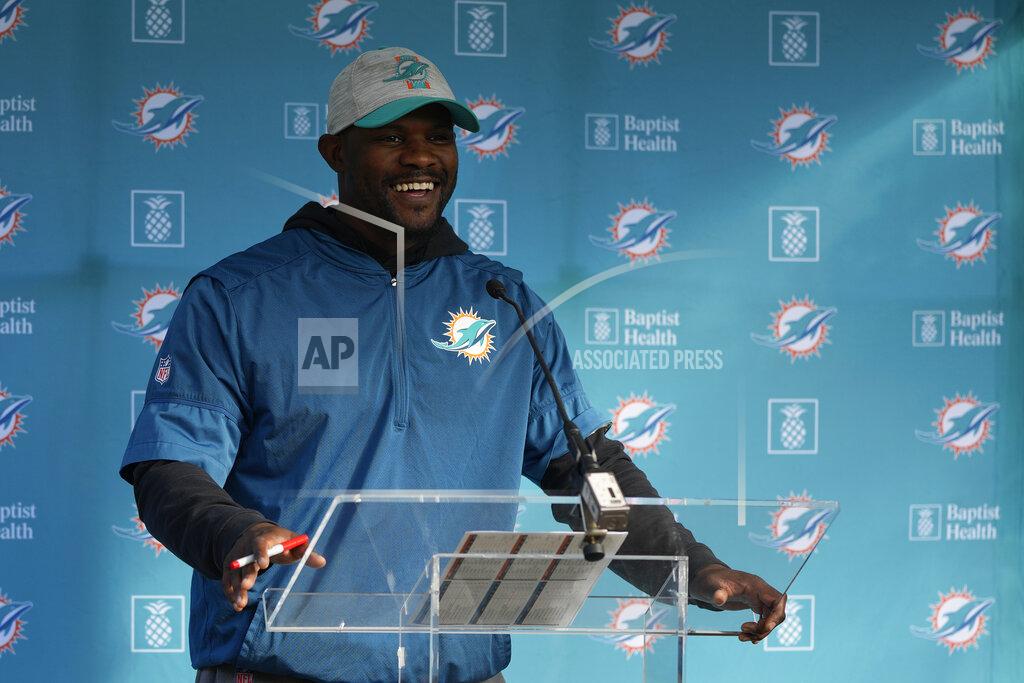 Alastair Grant Brian Flores Head Coach of the Miami Dolphins speaks to the press during a practice and media availability by the Miami Dolphins In Ware, England, Friday, Oct. 15, 2021. The Dolphins play the Jaguars in a regular season NFL game on Sunday at Tottenham Hotspurs White Hart Lane stadium in London. (AP Photo/Alastair Grant)