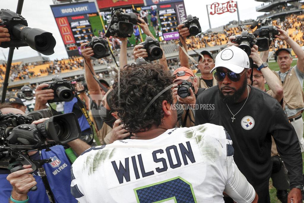 Don Wright Pittsburgh Steelers head coach Mike Tomlin, right, and Seattle Seahawks quarterback Russell Wilson (3) meet on the field after an NFL football game, Sunday, Sept. 15, 2019, in Pittsburgh. The Seahawks defeated the Steelers 28-26. (AP Photo/Don Wright)