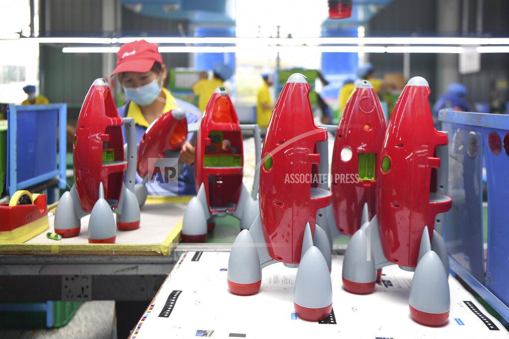 Xue Yuge In this May 27, 2020, photo released by Xinhua News Agency, a worker makes plastic toys at a factory in Zhangjiajie, central China's Hunan Province. The United States, Japan and France are prodding their companies to rely less on China to make the world’s smartphones, drugs and other products. But even after the coronavirus derailed global trade, few are willing to give up access to its skilled workers, vast market and efficient suppliers by moving factories closer to home. (Xue Yuge/Xinhua via AP)