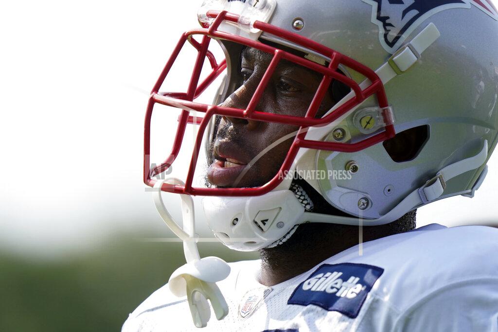 Steven Senne New England Patriots running back James White pauses during field drills at a joint NFL football practice with the New York Giants, Wednesday, Aug. 25, 2021, in Foxborough, Mass. (AP Photo/Steven Senne)