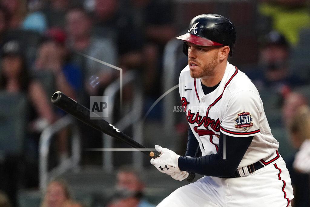John Bazemore Atlanta Braves first baseman Freddie Freeman (5) drives in a run with a base hit in the first inning of a baseball game against the Colorado Rockies Tuesday, Sept. 14, 2021, in Atlanta. (AP Photo/John Bazemore)