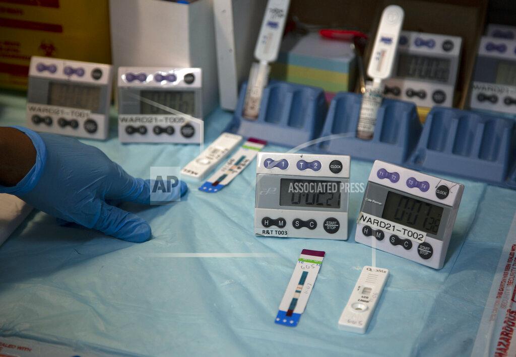 Denis Farrell Laboratory technicians test a blood sample for HIV infection at the Reproductive Health and HIV Institute (RHI) in Johannesburg,Thursday, Nov. 26 2020. The successful trials of a new injectable drug that needs to be taken every eight weeks to prevent HIV infection is being lauded on World AIDS Day as a turning point for the fight against a global health threat that's been eclipsed by the coronavirus pandemic. (AP Photo/Denis Farrell)