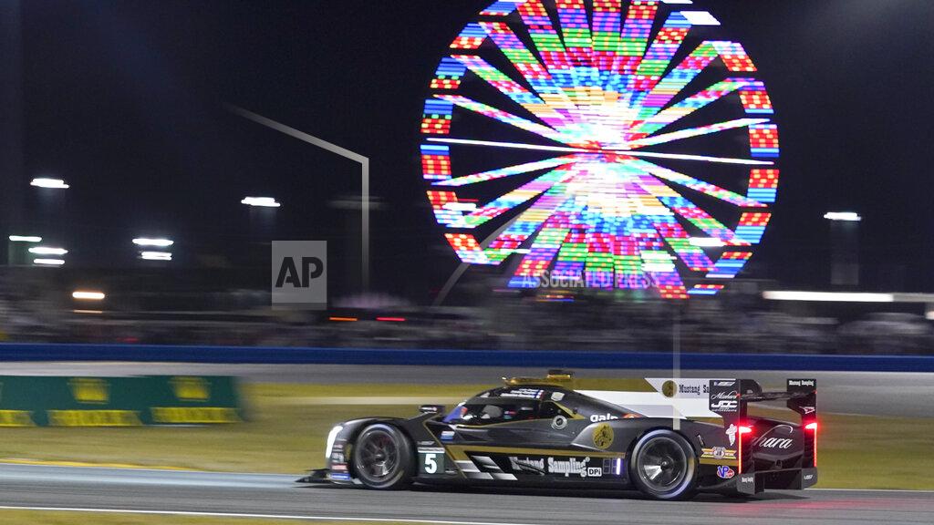 John Raoux Tristain Vautier, of France, drives the Cadillac DPi into the east horseshoe turn during the Rolex 24 hour auto race at Daytona International Speedway, Saturday, Jan. 30, 2021, in Daytona Beach, Fla. (AP Photo/John Raoux)