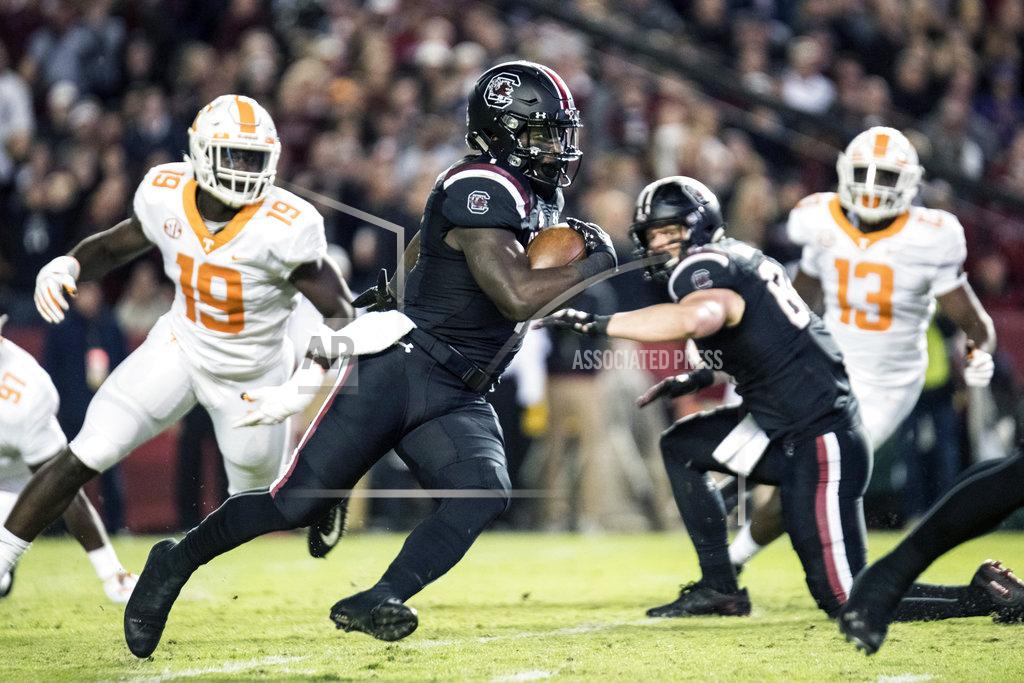 Sean Rayford South Carolina wide receiver Deebo Samuel, center, runs with the ball against Tennessee linebacker Darrell Taylor (19) during the first half of an NCAA college football game against Tennessee Saturday, Oct. 27, 2018, in Columbia, S.C. (AP Photo/Sean Rayford)