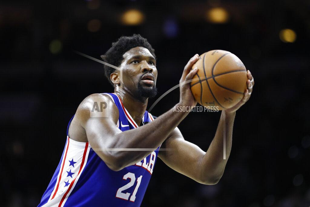 Matt Slocum FILE - In this March 11, 2020 file photo, Philadelphia 76ers' Joel Embiid plays during an NBA basketball game against the Detroit Pistons in Philadelphia. Embiid is hurting, and that's a cause for concern as the Philadelphia 76ers get set to restart their season this week. The All-Star starting center sat out Philadelphia's scrimmage against Oklahoma City on Sunday, July 26 with right calf tightness, something 76ers coach Brett Brown hopes is merely a minor blip. (AP Photo/Matt Slocum, File)