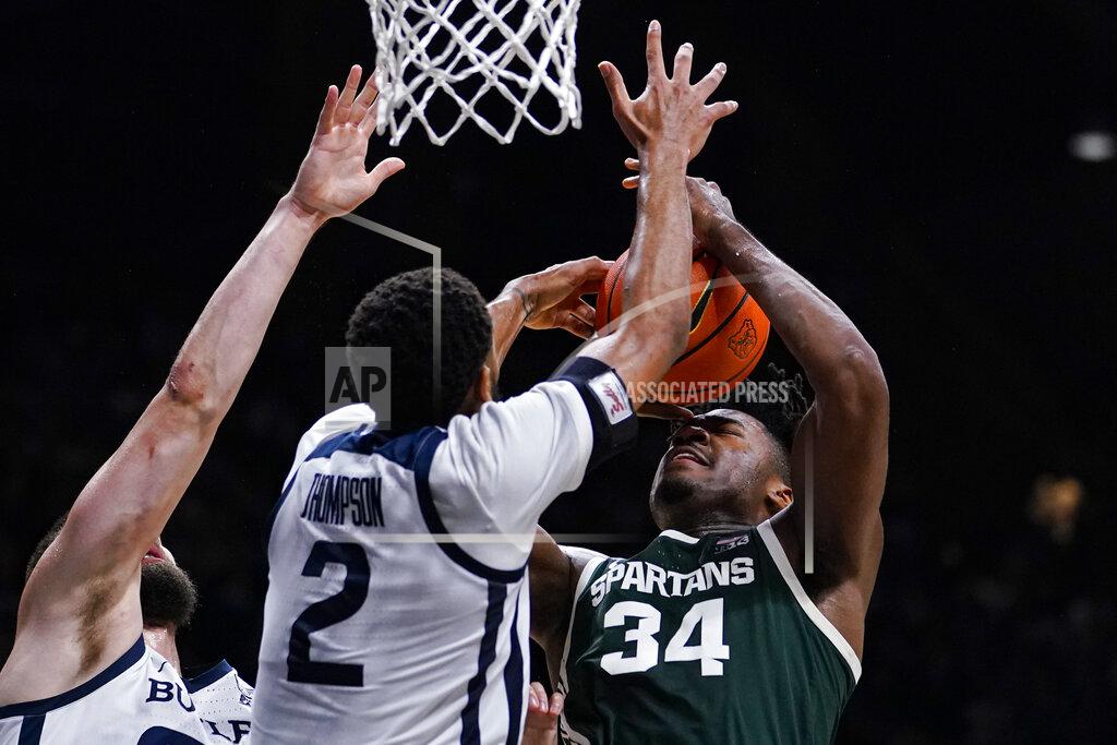 Michael Conroy Butler guard Aaron Thompson (2) blocks the shot of Michigan State forward Julius Marble II (34) in the second half of an NCAA college basketball game in Indianapolis, Wednesday, Nov. 17, 2021. Michigan State defeated Butler 73-52. (AP Photo/Michael Conroy)