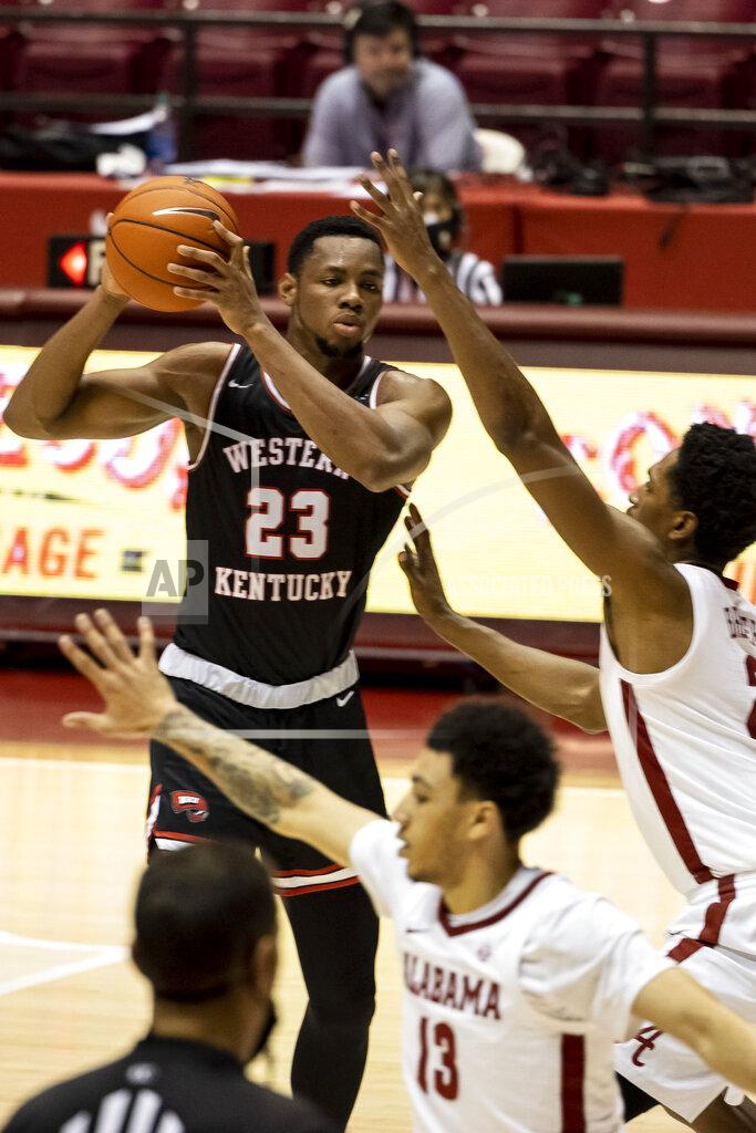 Vasha Hunt Western Kentucky center Charles Bassey (23) looks for a way inside against Alabama forward Jordan Bruner (2) during the first half of an NCAA college basketball game, Saturday, Dec. 19, 2020, in Tuscaloosa, Ala. (AP Photo/Vasha Hunt)