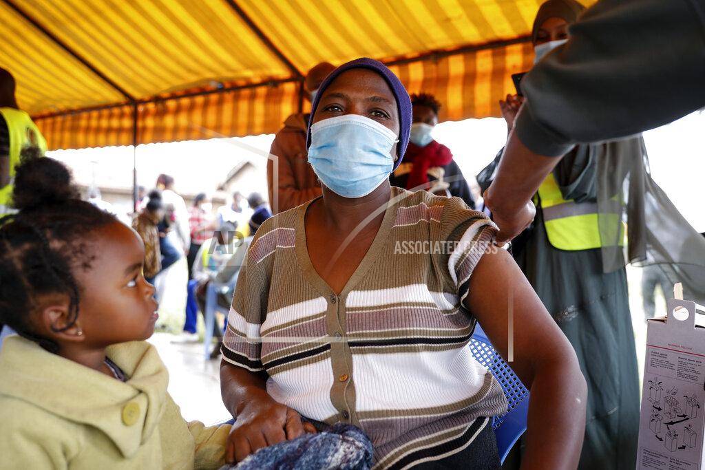 Brian Inganga A Kenyan woman receives a dose of AstraZeneca coronavirus vaccine donated by Britain, at the Makongeni Estate in Nairobi, Kenya Saturday, Aug. 14, 2021. In late June, the international system for sharing coronavirus vaccines sent about 530,000 doses to Britain – more than double the amount sent that month to the entire continent of Africa. It was the latest example of how a system that was supposed to guarantee low and middle-income countries vaccines is failing, leaving them at the mercy of haphazard donations from rich countries. (AP Photo/Brian Inganga)
