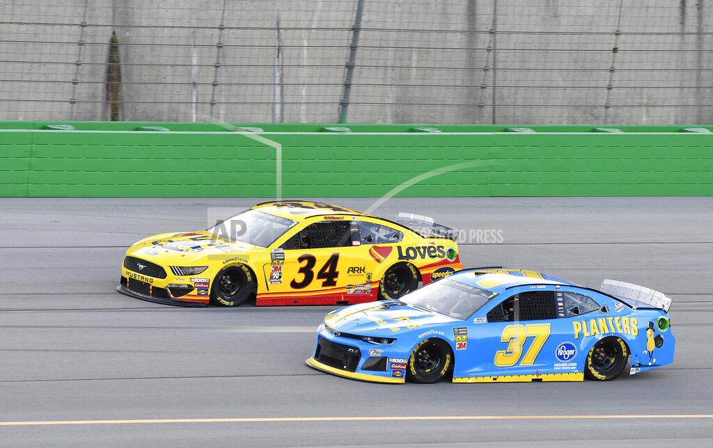 Timothy D. Easley Chris Buescher (37) takes the bottom of the track to try to pass Michael McDowell (34) during the NASCAR Cup Series auto race at Kentucky Speedway in Sparta, Ky., Saturday, July 13, 2019. (AP Photo/Timothy D. Easley)