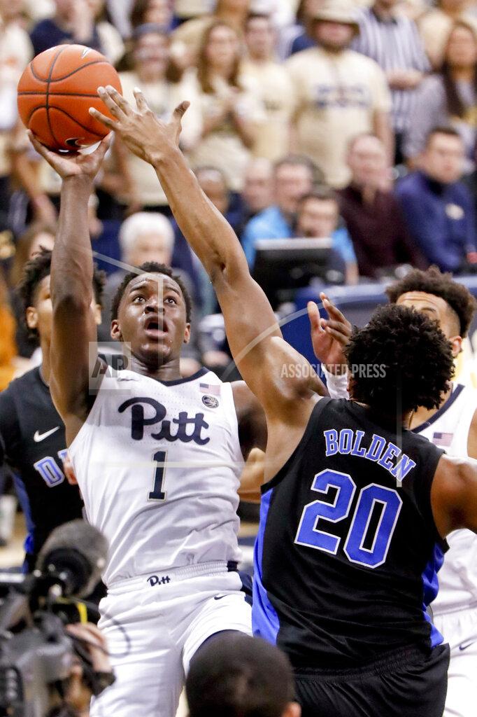 Keith Srakocic Pittsburgh's Xavier Johnson (1) shoots over Duke's Marques Bolden (20) during the first half of an NCAA college basketball game, Tuesday, Jan. 22, 2019, in Pittsburgh. (AP Photo/Keith Srakocic)