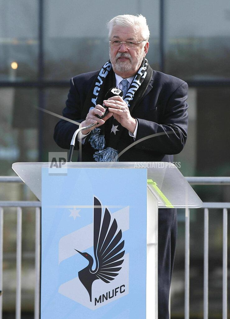 Jim Mone In this March 18, 2019, photo, Minnesota United FC Loons managing partner, Bill McGuire, addresses soccer supporters at a scarf raising ceremony in advance of the MSL soccer team's home opener April 13 against New York City FC in the new privately -funded Allianz Field stadium in St. Paul, Minn. (AP Photo/Jim Mone)