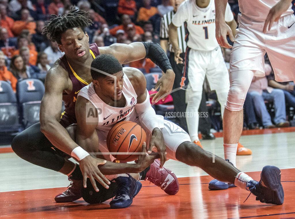 Rick Danzl Illinois forward Kipper Nichols (2) grabs a loose ball near Minnesota center Daniel Oturu during the second half of an NCAA college basketball game in Champaign, Ill., Wednesday, Jan. 16, 2019. (AP Photo/Rick Danzl)