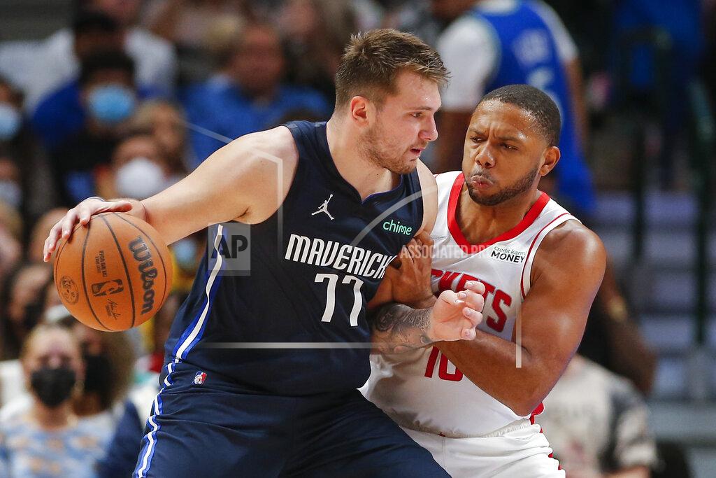 Brandon Wade Dallas Mavericks guard Luka Doncic (77) battles Houston Rockets guard Eric Gordon (10) for space during the second half of an NBA basketball game, Tuesday, Oct. 26, 2021, in Dallas. Dallas won 116-106. (AP Photo/Brandon Wade)
