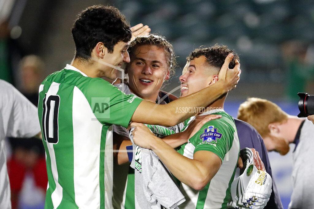 Karl B Deblaker Marshall's Pedro Dolabella (10), Max Schneider, center, and Jamil Roberts, right, celebrate following the team's 1-0 overtime win over Indiana at the NCAA College Cup championship soccer match in Cary, N.C., Monday, May 17, 2021. (AP Photo/Karl B DeBlaker)