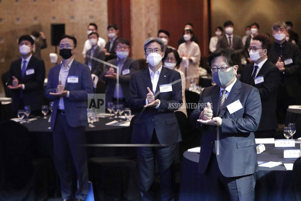 Ahn Young-Joon Participants wearing face masks to help protect against the spread of the new coronavirus gesture as they join the "Thank You Challenge" for medical workers fighting the coronavirus during the Yonhap News Symposium on Korean Peace in Seoul, South Korea, Tuesday, June 30, 2020. (AP Photo/Ahn Young-joon)
