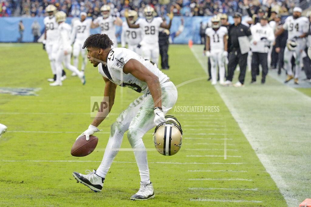 Mark Zaleski New Orleans Saints wide receiver Michael Thomas (13) picks up the ball after making a catch against the Tennessee Titans in the second half of an NFL football game Sunday, Dec. 22, 2019, in Nashville, Tenn. The catch gave Thomas the NFL single-season pass reception record. (AP Photo/Mark Zaleski)