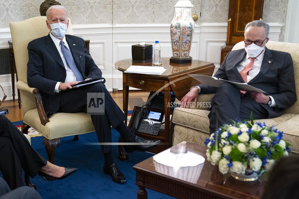 Evan Vucci President Joe Biden meets with Senate Majority Leader Sen. Chuck Schumer of N.Y., and other Democratic lawmakers to discuss a coronavirus relief package, in the Oval Office of the White House, Wednesday, Feb. 3, 2021, in Washington. (AP Photo/Evan Vucci)