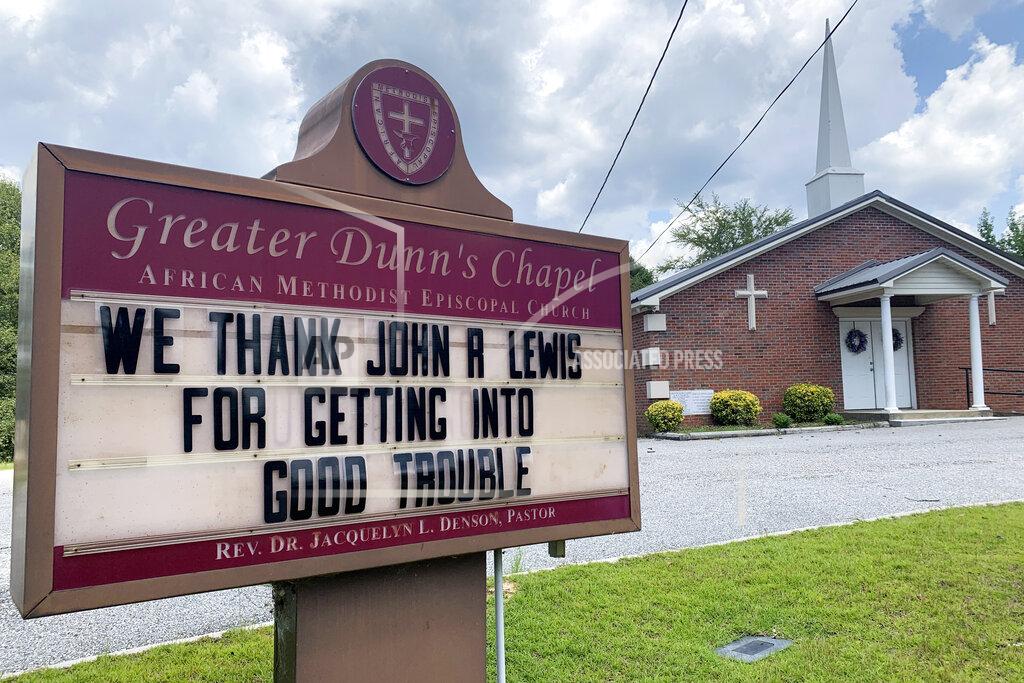 Kimberly Chandler In this July 20, 2020, photo, a church sign honoring the late U.S. Rep. John Lewis sits near his family's land in Pike County, Ala. A series of services will be held to remember Lewis, beginning July 25, 2020, in his home state of Alabama. (AP Photo/Kimberly Chandler)