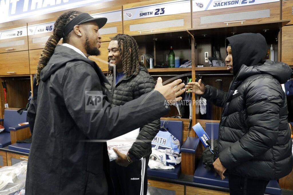 Mark Humphrey Tennessee Titans running back Derrick Henry, left, says goodbye to cornerback Tye Smith, center, and cornerback Adoree' Jackson, right, as players clean out their lockers Monday, Jan. 20, 2020, in Nashville, Tenn. The Titans lost the AFC Championship NFL football game Sunday to the Kansas City Chiefs. (AP Photo/Mark Humphrey)