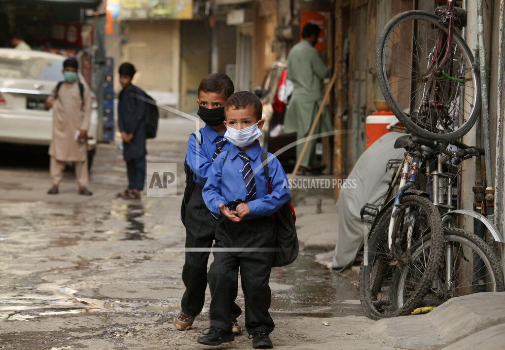 Muhammad Sajjad Students wear face masks to help prevent the spread of the coronavirus in Peshawar, Pakistan, Monday, June 7, 2021. Pakistani authorities reopened educational institutes following a steady decrease in deaths and infections from the coronavirus. (AP Photo/Muhammad Sajjad)