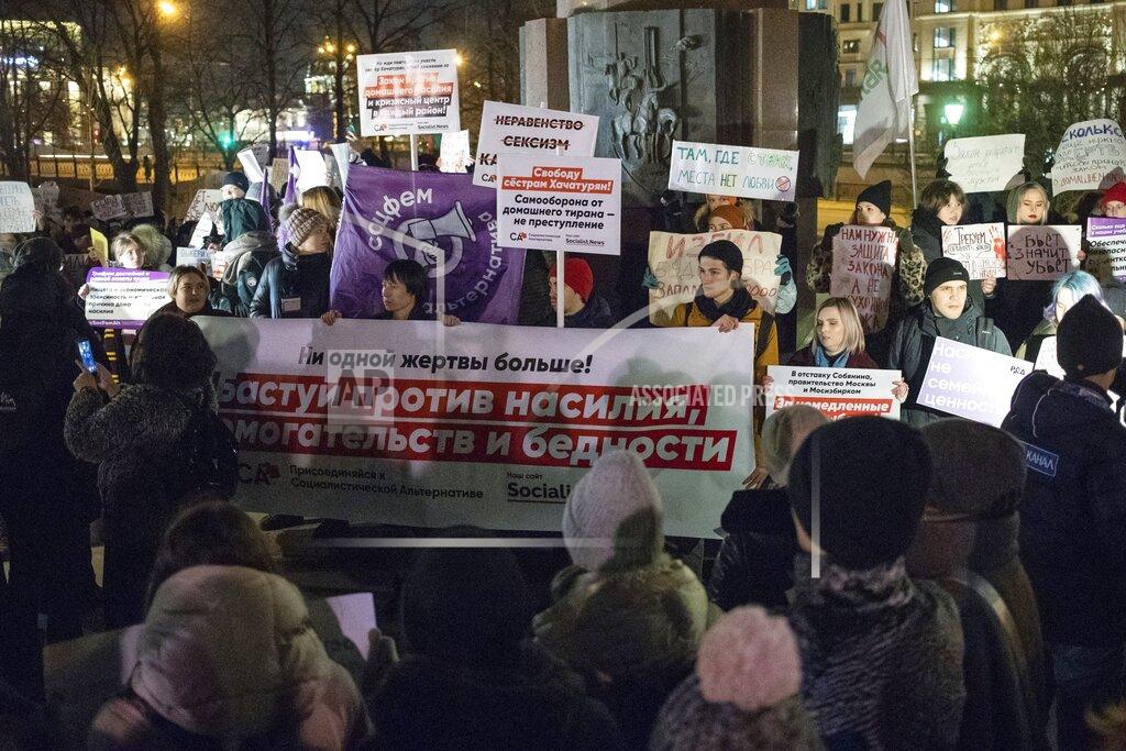 Pavel Golovkin FILE - In this Nov. 25, 2019, file photo, people hold banners against domestic violence as they attend a rally in Moscow's downtown, Russia. Few reliable official statistics are kept on violence against women in Russia, but it is clearly a national problem. Police routinely turn a blind eye to domestic abuse, and restraining orders don't exist, leaving victims without a key protection. (AP Photo/Pavel Golovkin, File)
