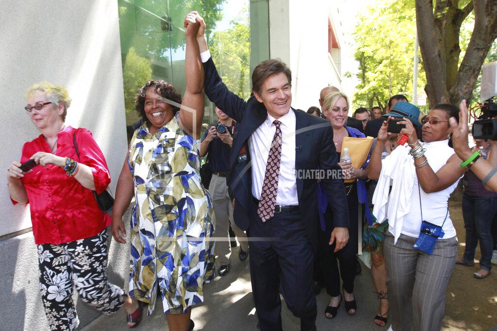 Rich Pedroncelli FILE - In this April 30, 2012, file photo, Yvonne Walker, president of the Service Employees International Union Local 1000, leads a walk for health with Dr. Mehmet Oz, in downtown in Sacramento, Calif. The president of California's largest state employees union has been ousted from the post she held for 13 years and replaced by a candidate who promises to end the organization's political involvement while bolstering its membership, according to results from a low-turnout election posted by the union. Under Walker's leadership since 2008, SEIU Local 1000 was a thorn in the side of the state's last Republican governor, Arnold Schwarzenegger, but grudgingly negotiated other austerity moves with his two Democratic successors. (AP Photo/Rich Pedroncelli, File)
