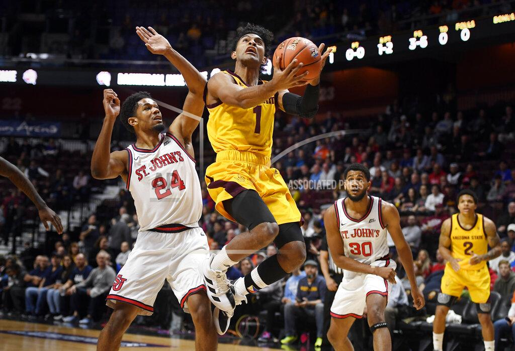 Jessica Hill Arizona State's Remy Martin (1) shoots as St. John's Nick Rutherford (24) defends during the first half of an NCAA college basketball game, Saturday, Nov. 23, 2019, in Uncasville, Conn. (AP Photo/Jessica Hill)