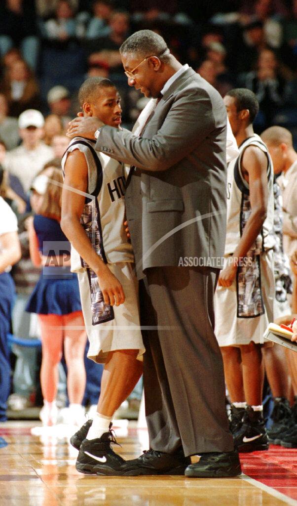 Porter Binks FILE - In this Jan. 24, 1996, file photo, Georgetown head coach John Thompson talks to Allen Iverson during an NCAA college basketball game against St. John's, in Landover, Md. Thompson, the imposing Hall of Famer who turned Georgetown into a basketball powerhouse and became the first Black coach to lead a team to the NCAA men’s title, has died at age 78, his family announced through the university, Monday, Aug. 31, 2020. (Porter Binks/USA Today via AP, File)
