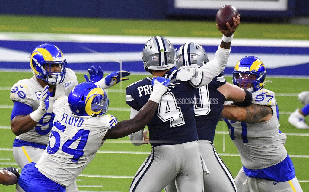 Outside linebacker Leonard Floyd (54) of the Los Angeles Rams pressures quarterback Dak Prescott (4) of the Dallas Cowboys in the first half of a NFL football game on opening night at SoFi Stadium in Inglewood on Sunday, September 13, 2020. (Keith Birmingham/The Orange County Register via AP)