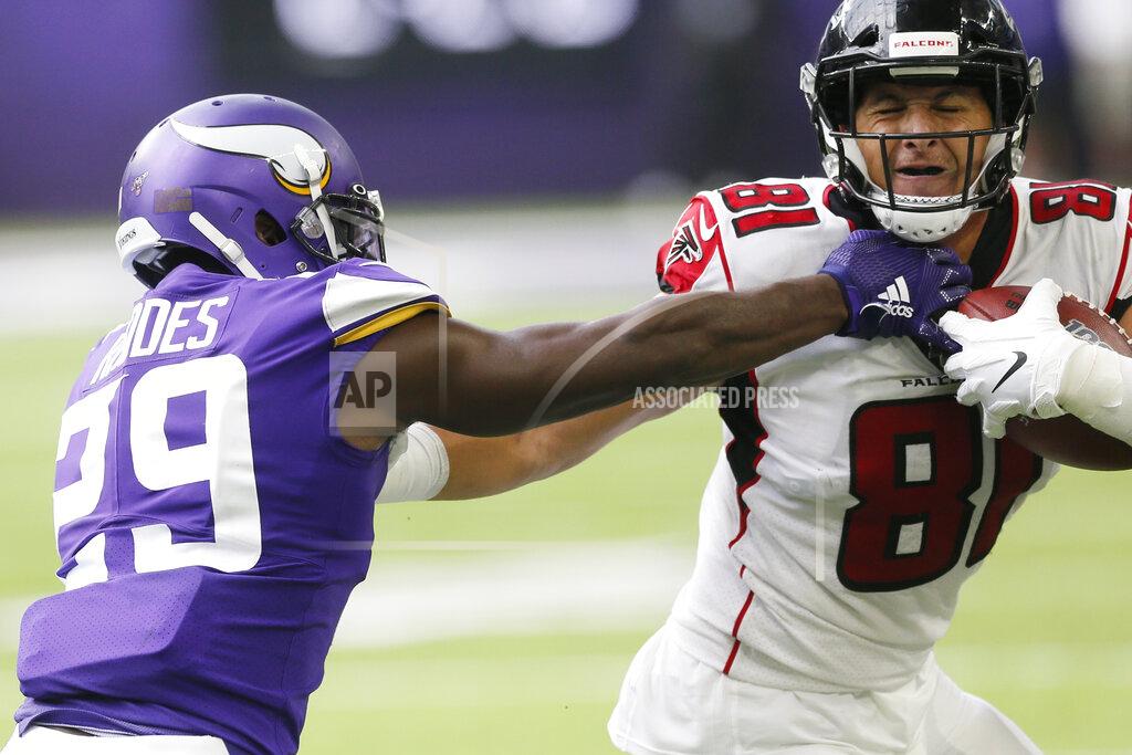 Jim Mone Atlanta Falcons tight end Austin Hooper (81) tries to break a tackle by Minnesota Vikings cornerback Xavier Rhodes during the first half of an NFL football game Sunday, Sept. 8, 2019, in Minneapolis. (AP Photo/Jim Mone)