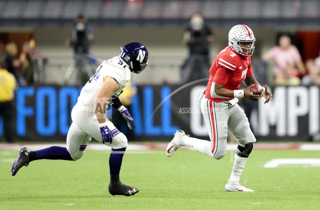 Aj Mast Ohio State quarterback Dwayne Haskins (7) scrambles past Northwestern's Blake Gallagher (51) during the first half of the Big Ten championship NCAA college football game, Saturday, Dec. 1, 2018, in Indianapolis. (AP Photo/AJ Mast)