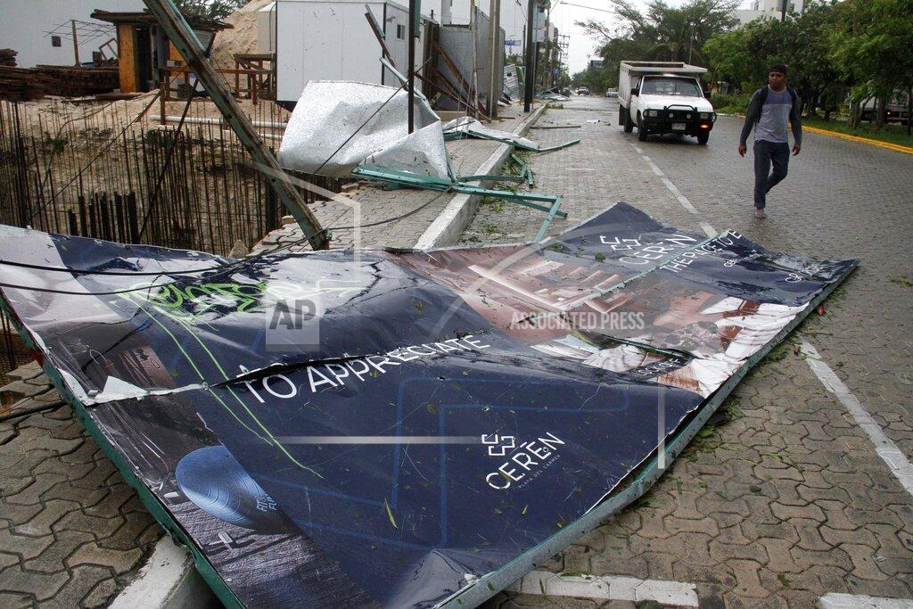 Tomas Stargardter A billboard lays on the ground, toppled by Hurricane Zeta in Playa del Carmen, Mexico, early Tuesday, Oct. 27, 2020. Zeta is leaving Mexico’s Yucatan Peninsula on a path that could hit New Orleans Wednesday night. (AP Photo/Tomas Stargardter)