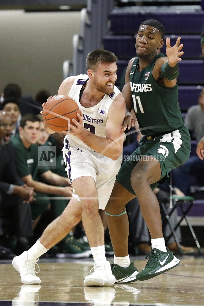 Nam Y. Huh Michigan State forward Aaron Henry, right, guards Northwestern guard Pat Spencer during the first half of an NCAA college basketball game Wednesday, Dec. 18, 2019, in Evanston, Ill. (AP Photo/Nam Y. Huh)