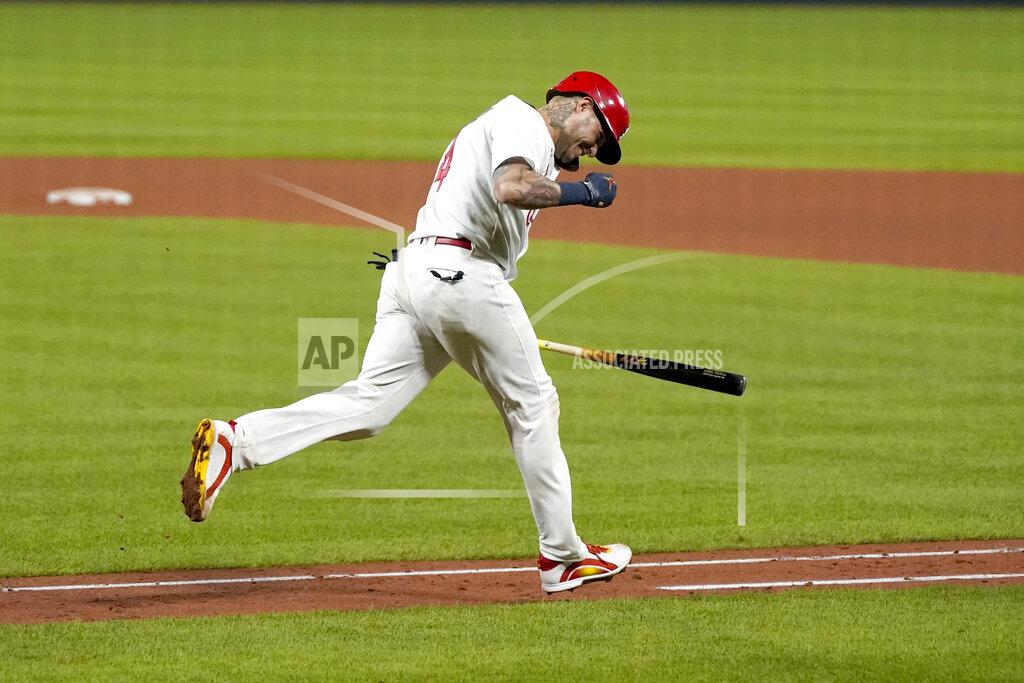 Jeff Roberson St. Louis Cardinals' Yadier Molina celebrates after hitting a single for his 2,000th career hit during the seventh inning of a baseball game against the Milwaukee Brewers Thursday, Sept. 24, 2020, in St. Louis. (AP Photo/Jeff Roberson)