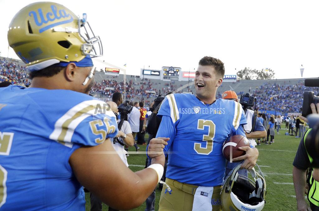 Marcio Jose Sanchez UCLA quarterback Wilton Speight (3) celebrates with teammate Atonio Mafi after a win over Southern California in an NCAA college football game Saturday, Nov. 17, 2018, in Pasadena, Calif. (AP Photo/Marcio Jose Sanchez)