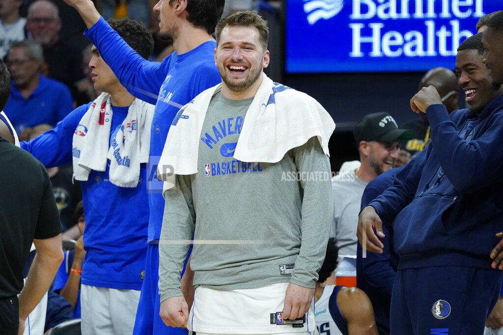 Matt York Dallas Mavericks guard Luka Doncic smiles on the bench during the second half of Game 7 of an NBA basketball Western Conference playoff semifinal against the Phoenix Suns, Sunday, May 15, 2022, in Phoenix. The Mavericks defeated the Suns 123-90. (AP Photo/Matt York)