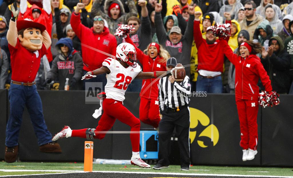 Charlie Neibergall FILE - In this Nov. 23, 2018, file photo, Nebraska running back Maurice Washington celebrates after catching a 28-yard touchdown pass during the second half of an NCAA college football game against Iowa, in Iowa City, Iowa. Nebraska running back Maurice Washington has turned himself in to California authorities to face felony and misdemeanor charges related to his possession and distribution of a video of his former girlfriend allegedly being sexually assaulted by two other people in 2016. Deputy Michael Low of the Santa Clara County sheriff’s office in San Jose said Washington surrendered about 7 a.m. PDT on Monday, March 11, 2019, and bailed out. (AP Photo/Charlie Neibergall, File)