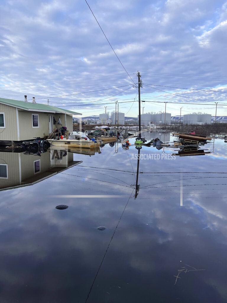Nathan Hadley Jr. This photo provided by Nathan Hadley Jr. shows flooding in the village of Buckland, Alaska, on Thursday, May 13, 2021. An ice jam on the Buckland River, a half mile below the community, has caused the entire village of about 500 residents in northwest Alaska to be completely inundated. (Nathan Hadley Jr. via AP)
