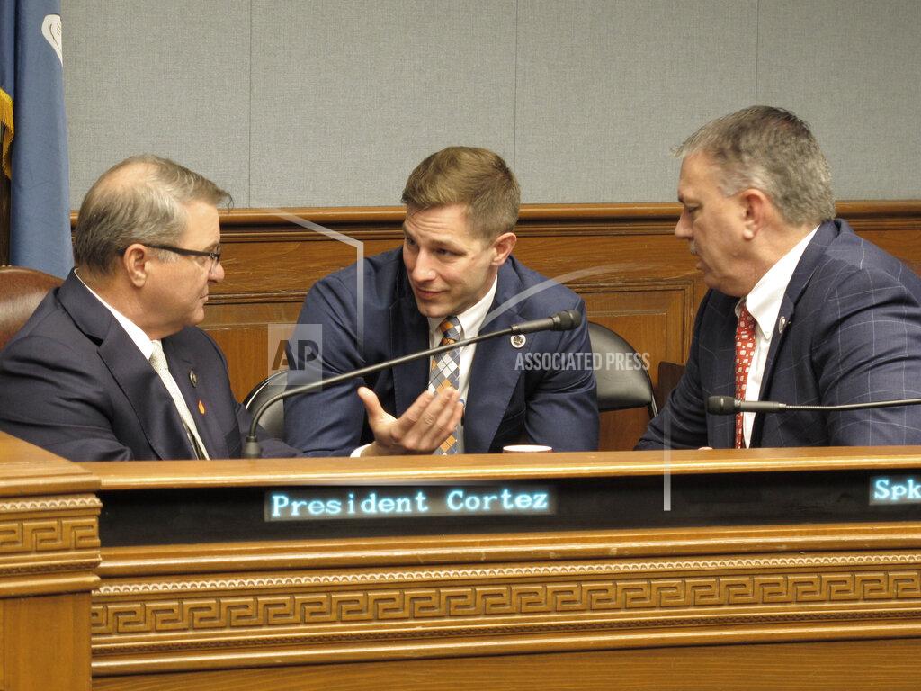 Melinda Deslatte Rep. John Stefanski, R-Crowley, center, speaks to Senate President Page Cortez, R-Lafayette, left, and House Speaker Clay Schexnayder, R-Gonzales, as Louisiana lawmakers near the end of their special session, on Thursday, June 25, 2020, in Baton Rouge, La. (AP Photo/Melinda Deslatte)