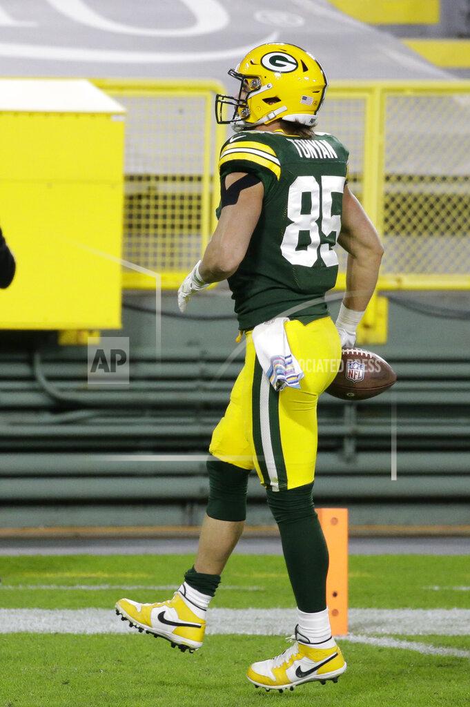 Tom Lynn Green Bay Packers' Robert Tonyan (85) goes in for a touchdown during the second half of an NFL football game against the Atlanta Falcons, Monday, Oct. 5, 2020, in Green Bay, Wis. (AP Photo/Tom Lynn)