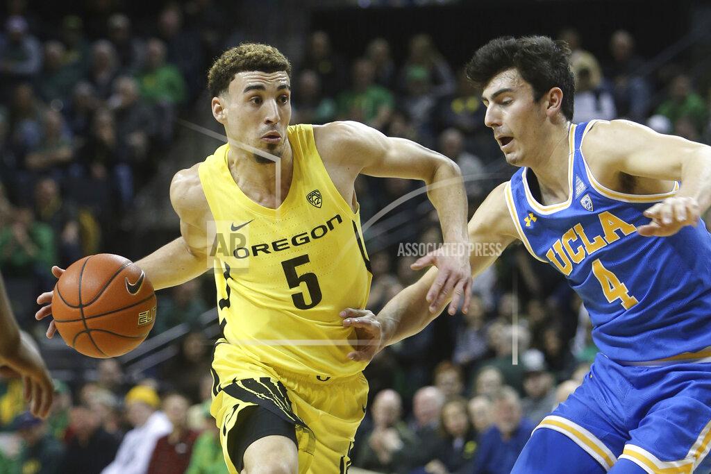 Chris Pietsch Oregon's Chris Duarte, left, drives to the basket against UCLA's Jaime Jaquez Jr. during the first half of an NCAA college basketball game in Eugene, Ore., Sunday, Jan. 26, 2020. (AP Photo/Chris Pietsch)