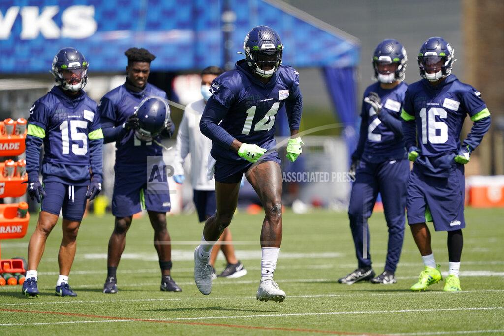 Ted S. Warren Seattle Seahawks wide receiver DK Metcalf (14) runs a practice drill during NFL football training camp, Wednesday, Aug. 12, 2020, in Renton, Wash. (AP Photo/Ted S. Warren, Pool)
