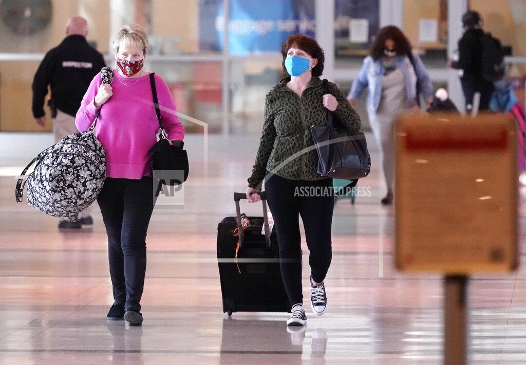 Lm Otero To prevent the spread of Covid-19, travelers wear masks at Love Field Tuesday, March 2, 2021, in Dallas. (AP Photo/LM Otero)