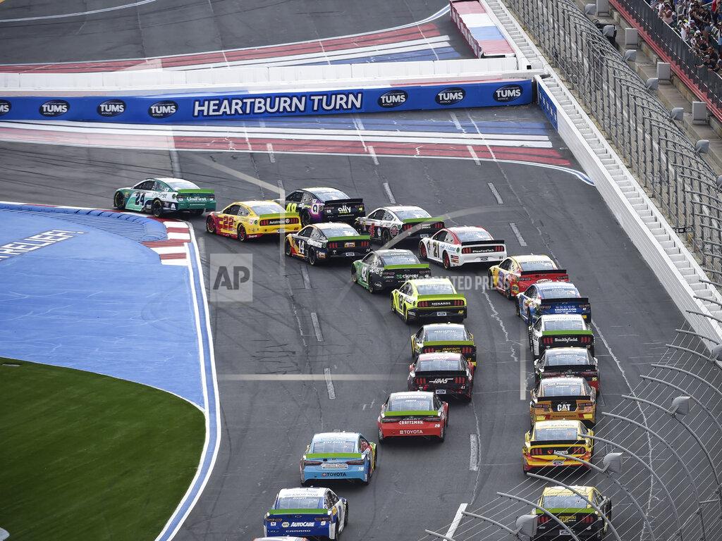 Mike Mccarn William Byron (24) leads through Turn 1 at the start of a NASCAR Cup Series auto race at Charlotte Motor Speedway, Sunday, Sept. 29, 2019, in Concord, N.C. (AP Photo/Mike McCarn)