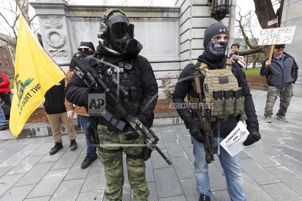 Michael Dwyer Members of the Boogaloo Movement, attend a demonstration against the lockdown over concern about COVID-19 at the State House, Saturday, April 18, 2020, in Concord, N.H. (AP Photo/Michael Dwyer)