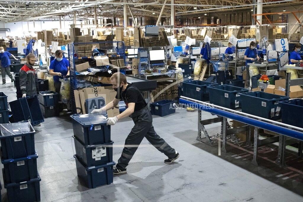 Pavel Golovkin Employees work at Ozon, a major Russian e-commerce platform similar to Amazon, in Moscow, Russia, Thursday, March 25, 2021. Ozon saw its sales jump almost 2.5 times last year, the company’s communications director Maria Zaikina said. (AP Photo/Pavel Golovkin)