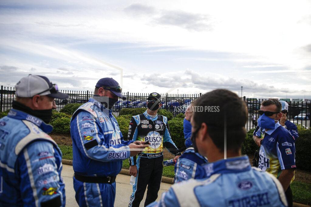 Kevin Harvick, third from left, celebrates with members of his crew after winning a NASCAR Cup Series auto race at Atlanta Motor Speedway, Sunday, June 7, 2020, in Hampton, Ga. (AP Photo/Brynn Anderson)