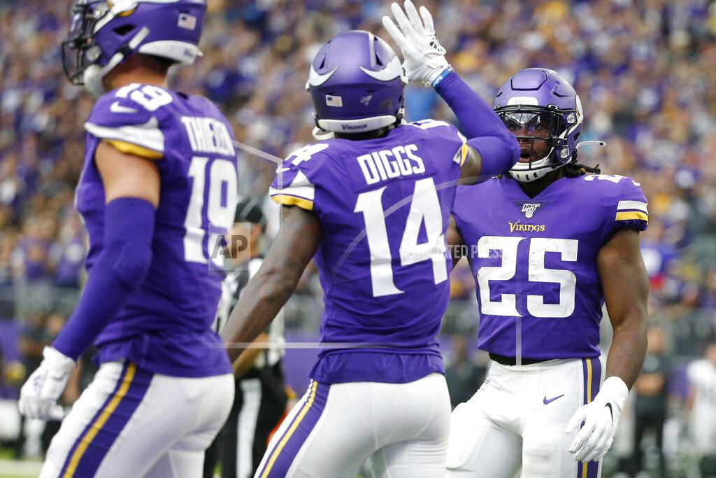 Bruce Kluckhohn Minnesota Vikings running back Alexander Mattison (25) celebrates with teammate Stefon Diggs (14) after scoring on a 10-yard touchdown run during the second half of an NFL football game against the Oakland Raiders, Sunday, Sept. 22, 2019, in Minneapolis. (AP Photo/Bruce Kluckhohn)