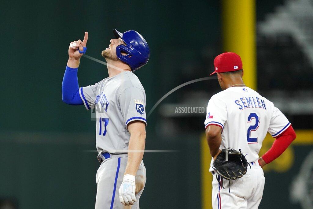 Tony Gutierrez Kansas City Royals' Hunter Dozier (17) celebrates his double as Texas Rangers second baseman Marcus Semien stands by in the fifth inning of a baseball game, Tuesday, May 10, 2022, in Arlington, Texas. (AP Photo/Tony Gutierrez)